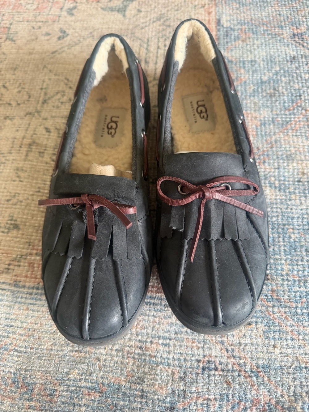 UGG Black Moccasin Slippers with Brown Accent Laces